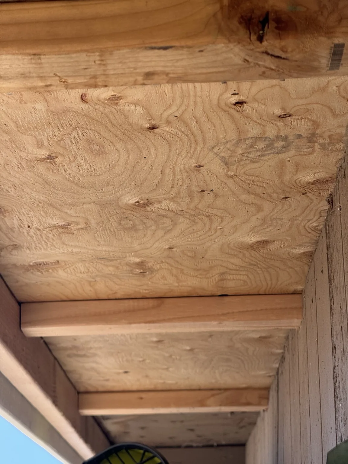 Checking the roof from below during residential roof repair