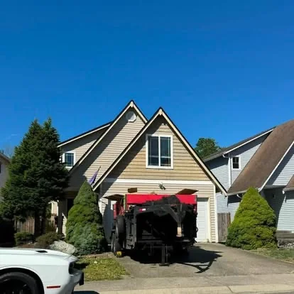 Rain Valley Roofing crew working on a residential roof