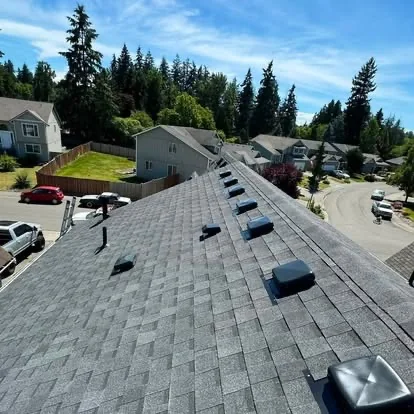 Completed residential roof with ventilation features